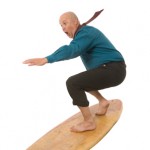 Bald man on surfboard Bald man on surfboard