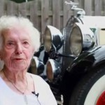 Margaret sitting beside her Packard car Margaret sitting beside her Packard car