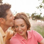 couple in grass man kissing her head 598 x298 couple in grass man kissing her head 598 x298