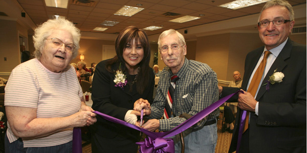 John Bleecker, 84 and Eileen Thomson, 87, help The Honourable Sophia Aggelonitis, MPP and Minister Responsible for Seniors, and Revera CEO Jeff Lozon cut the ribbon at Tuesday’s Grand Opening event at The Beechwood Retirement Community in Mississauga.