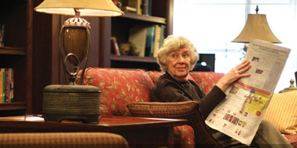 Lady reading newspaper